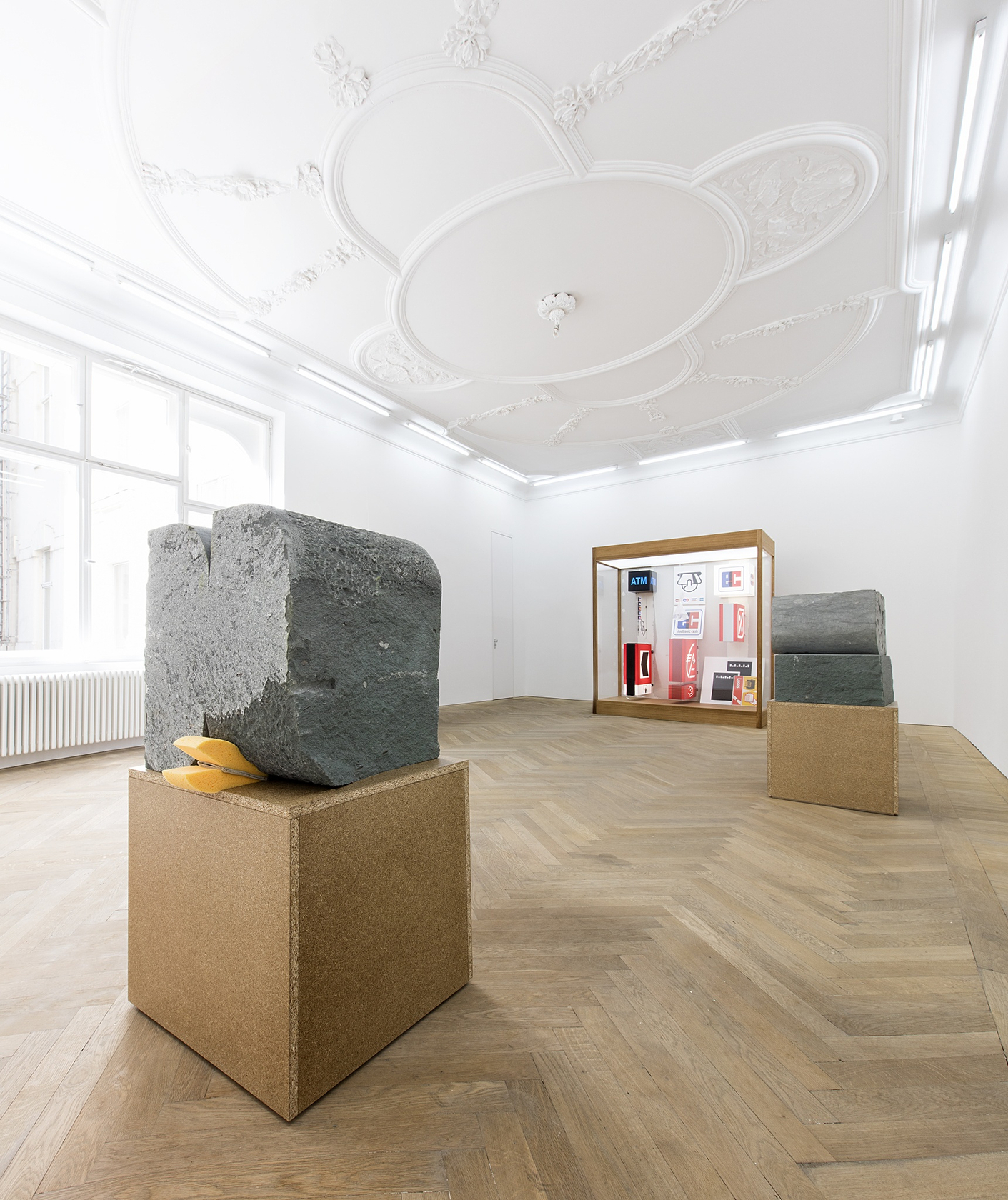 Forecast, 2015 (center) Mixed media in wood and plexiglas vitrine with interior lighting The vitrine contains tightly grouped light boxes...