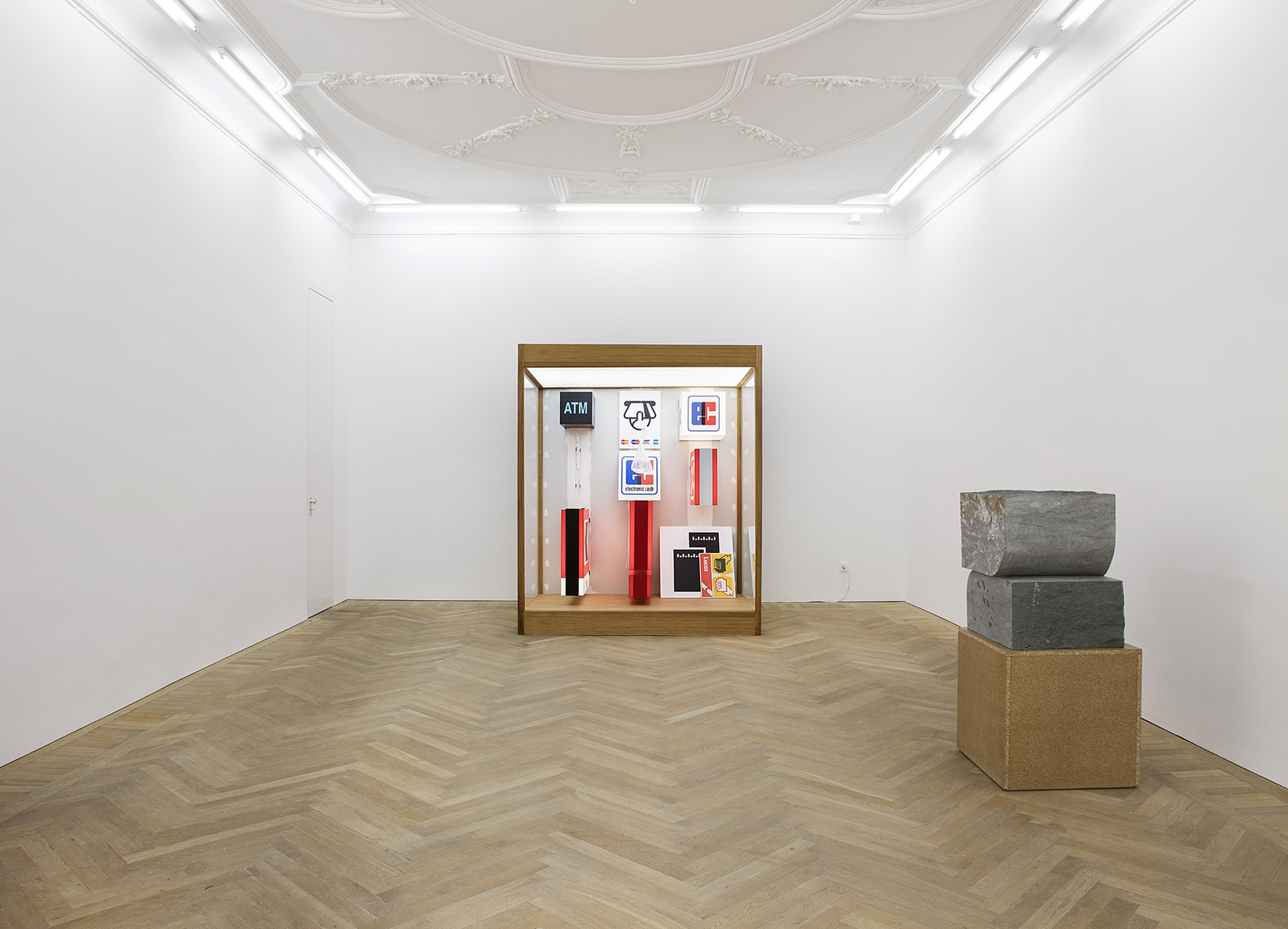 Forecast, 2015 (center) Mixed media in wood and plexiglas vitrine with interior lighting The vitrine contains tightly grouped light boxes...