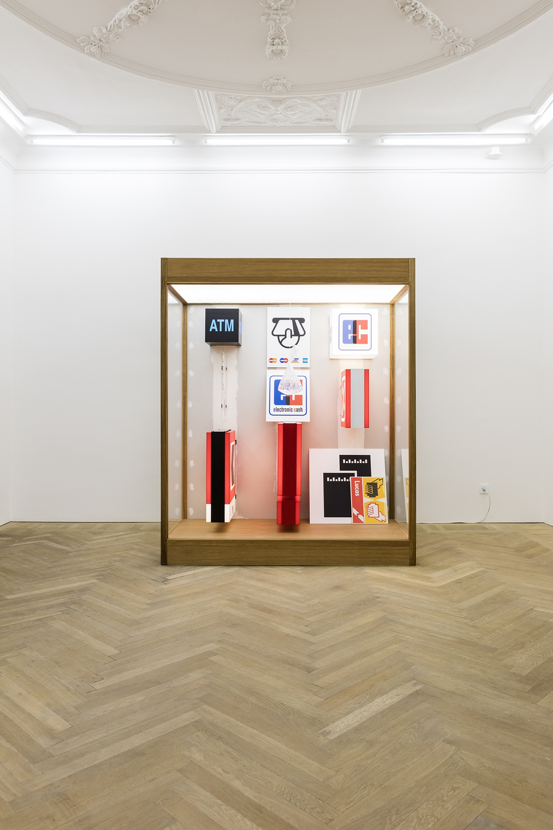 Forecast, 2015 Mixed media in wood and plexiglas vitrine with interior lighting The vitrine contains tightly grouped light boxes with...