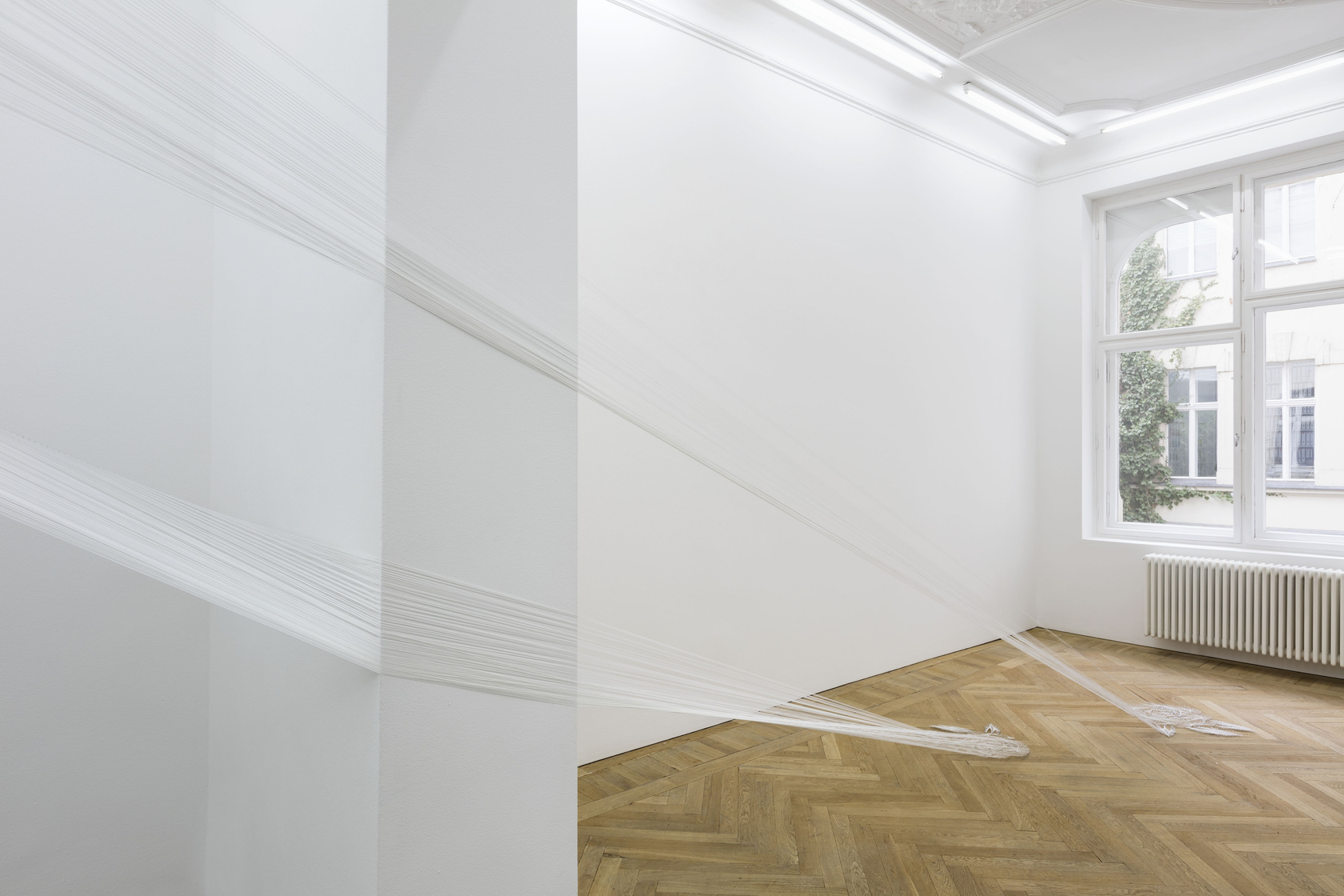 Hyperboloïde IX, 2016 (detail) Thread, nails The architectural intervention connects different rooms. The threads originate from an ornamental floral pattern...