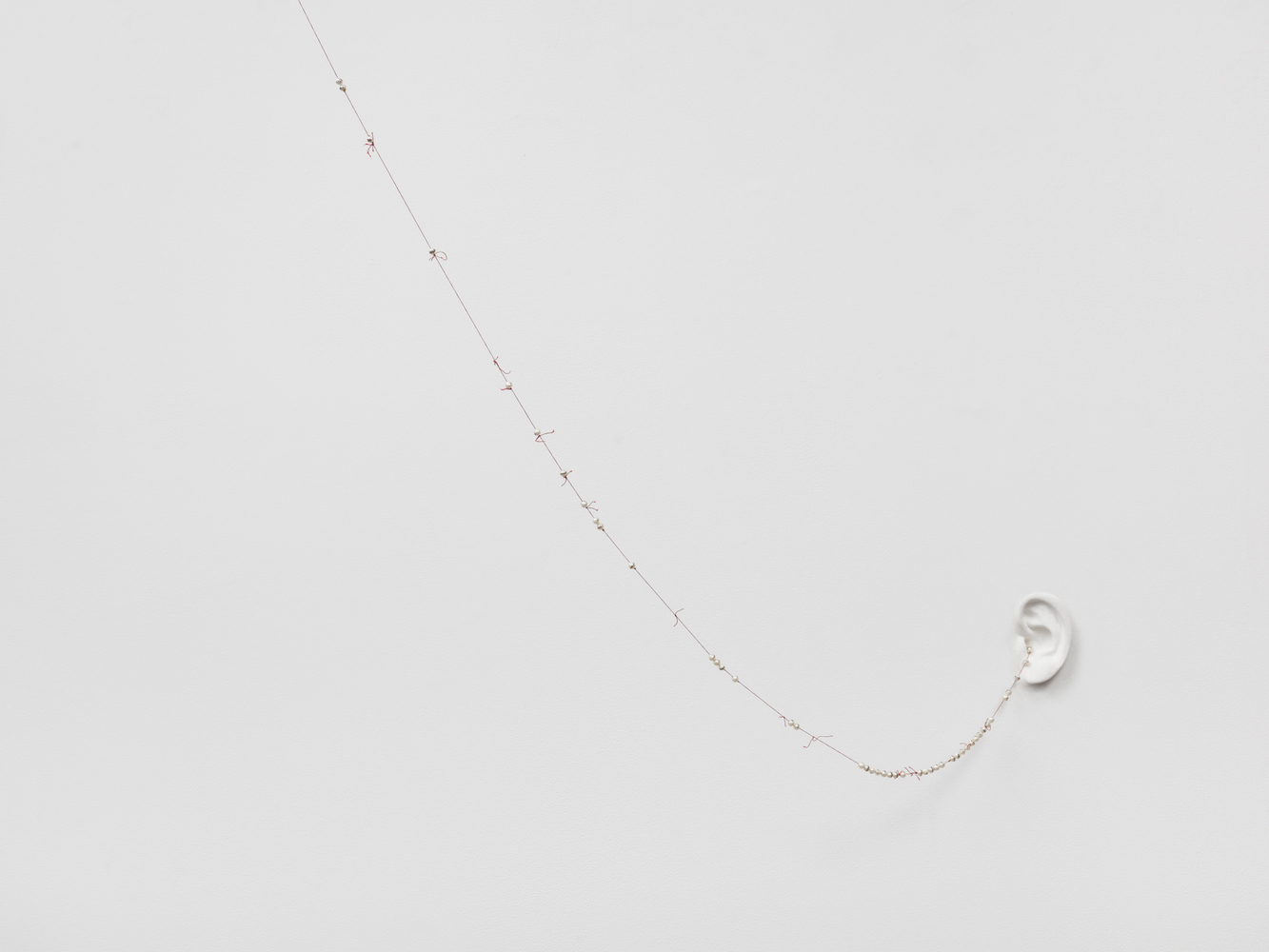 Yo no soy digno de que vengas a m&amp;iacute;, pero una palabra tuya bastar&amp;aacute; para sanar mi alma, 1996

cast gesso, cotton thread with incised pearls, unique

ear: 4 3/4 x 3 1/8 in. / 12.1 x 7.9 cm

installation dimensions variable
