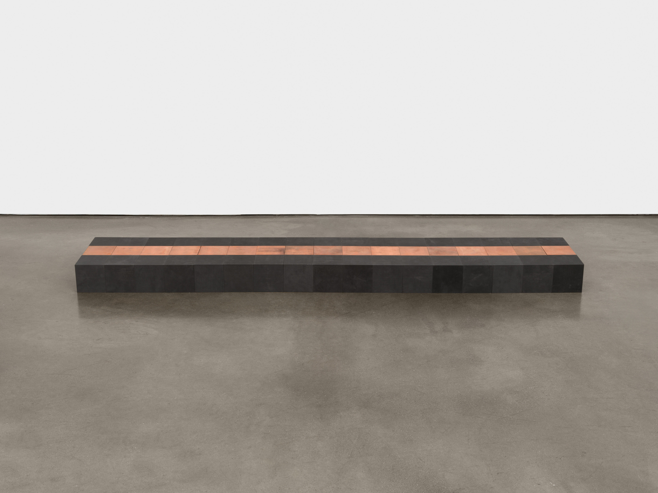 Carl Andre

51 Copper-Carbon Vein, 2006

51 cubes, 17 copper and 34 carbon

overall: 3 7/8 x 11 3/4 x 66 7/8 in. (10 x 30 x 170 cm)

each: 3 7/8 x 3 7/8 x 3 7/8 in. (10 x 10 x 10 cm)
