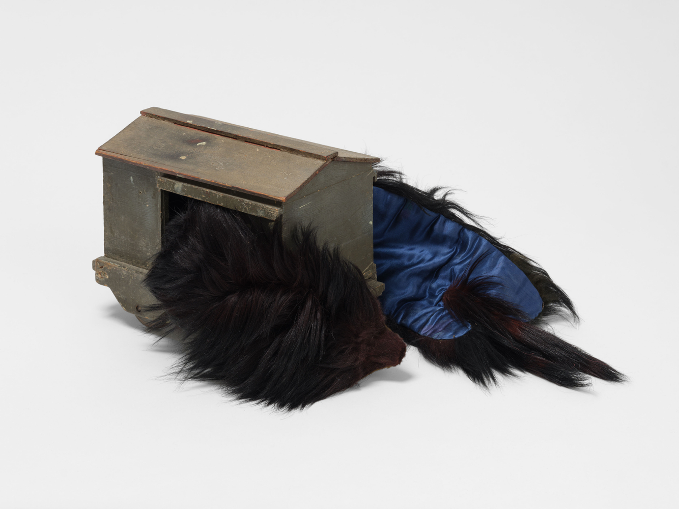 Terry Adkins
Monkey Man, 2008
wood and artificial fur with satin lining
overall: 10 1/2 x 26 x 12 in. (26.7 x 66 x 30.5 cm)

fur: 3 x 36 x 10 in. (7.6 x 91.4 x 25.4 cm)

wooden element: 10 1/2 x 7 3/4 x 13 in. (26.7 x 19.7 x 33 cm)