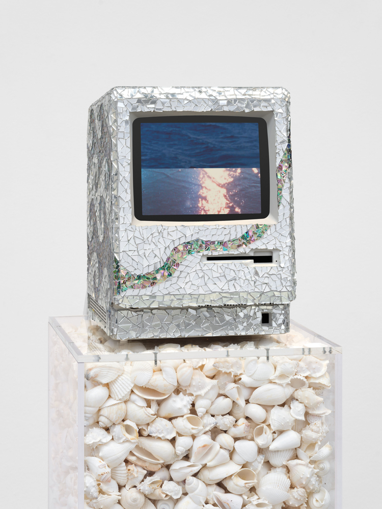 Ja&amp;#39;Tovia Gary
LIVING WATERS, 2025
Macintosh M0001 computer monitor, mirrored glass mosaic, digital video, stereo sound, and acrylic pedestal with bleached shells
computer monitor: 13 5/8 x 9 5/8 x 10 7/8 in. (34.6 x 24.4 x 27.6 cm)

pedestal: 36 x 14 x 14 in. (91.4 x 35.6 x 35.6 cm)

Sold