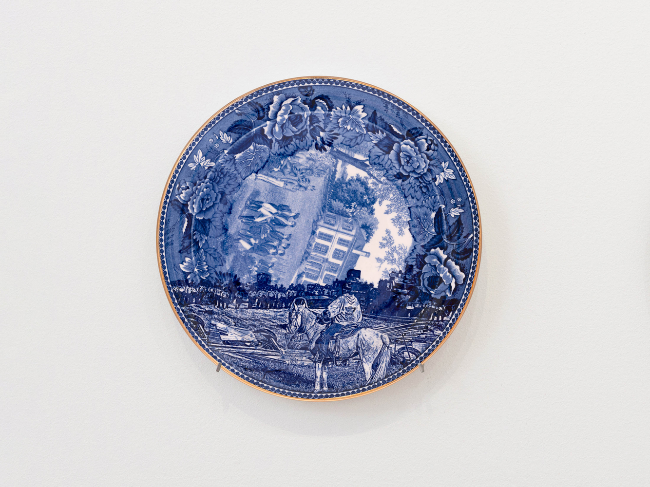 PAUL SCOTT

Cumbrian Blue(s), New American Scenery, Broken Treaties (after Ryan Vizzions, with Mega May Plenty Chief, Lakota Oyate on horseback), 02/04/12/23, 2023

Transferprint collage on Wedgwood souvenir plate of The Harrison Mansion

10.25&amp;quot; Dia. x 1&amp;quot; D