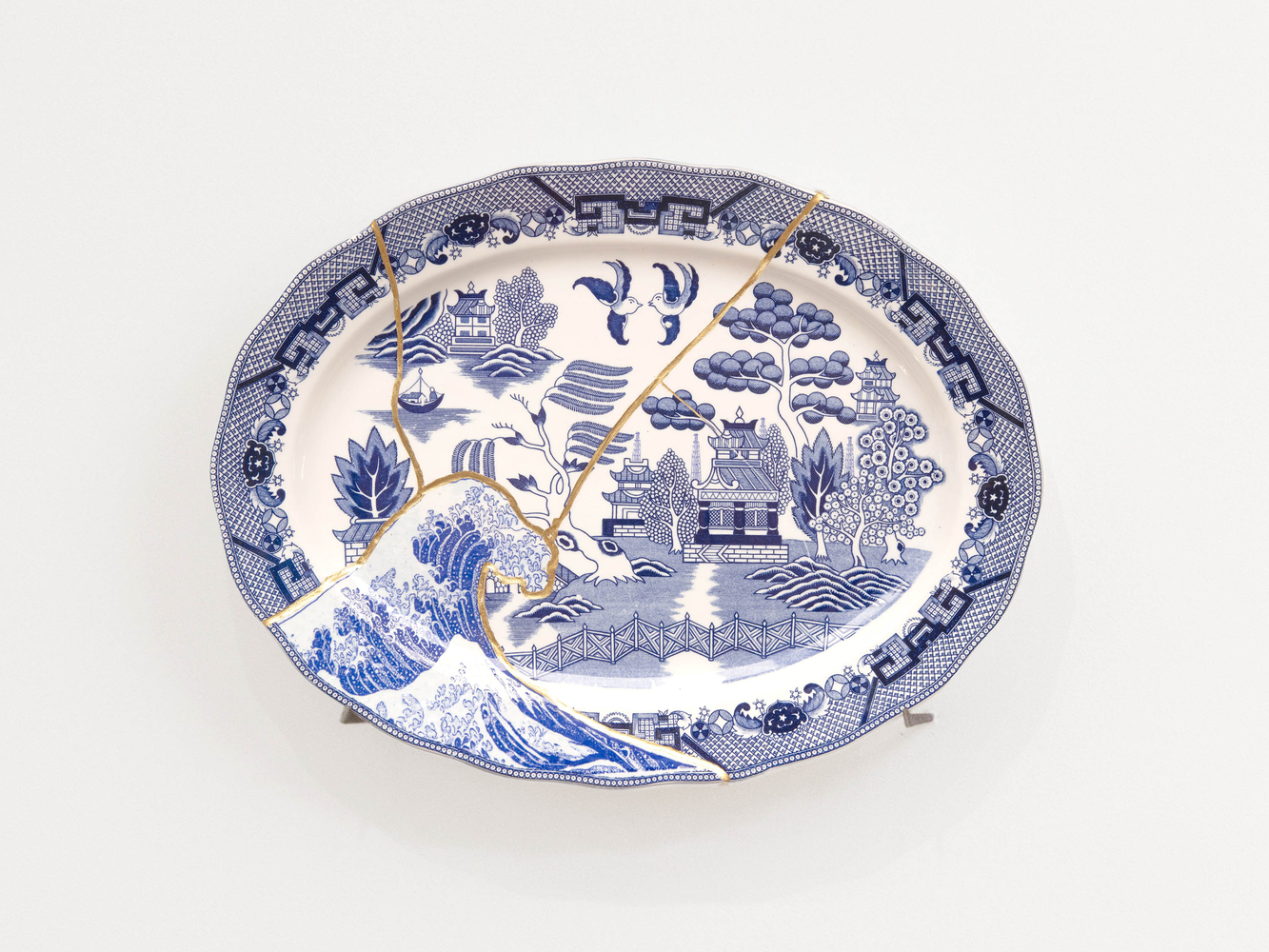 PAUL SCOTT

Cumbrian Blue(s), Fukushima No.11, 04/04/11/24, 2025

Transfer print collage on broken and re-assembled willow pattern platter, marked Japan (c.1965) with Kintsugi

13.75&amp;quot; H &amp;times; 18&amp;quot; W &amp;times; 1.5&amp;quot; D