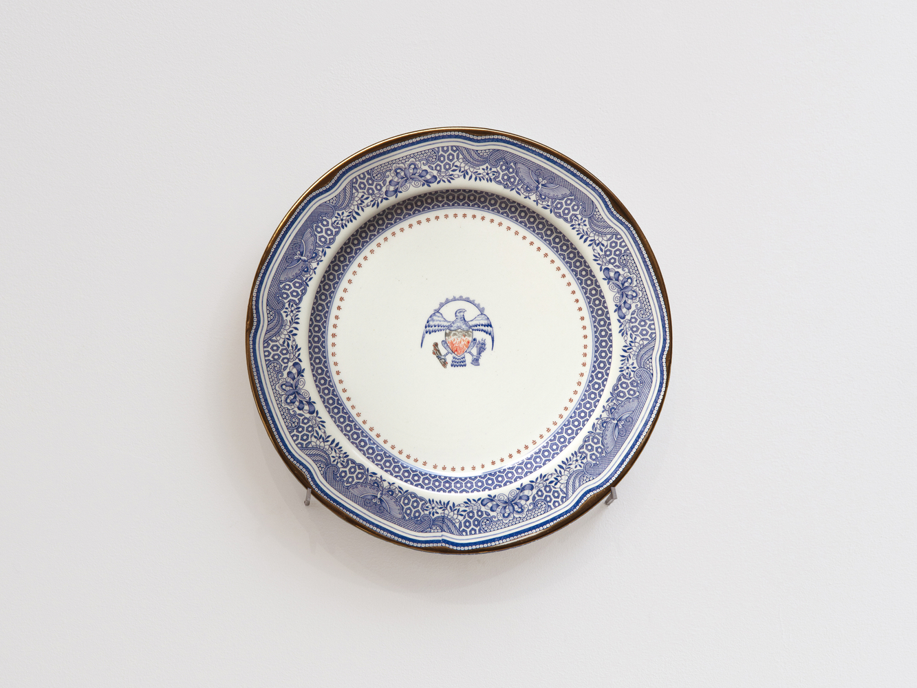 PAUL SCOTT

Cumbrian Blue(s), New American Scenery, Heritage and The Sleep of Reason, 2025

Transfer print collage and gold on pearlware plate

11.25&amp;rdquo; Dia. x 0.5&amp;rdquo; D