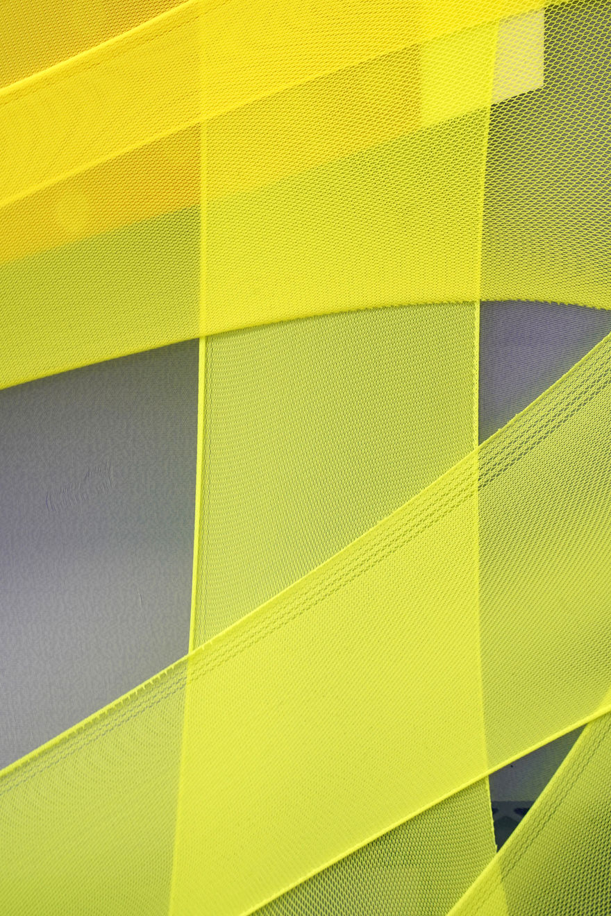 abstract fabric collage with a snippet of a photo of a person wearing a rain jacket