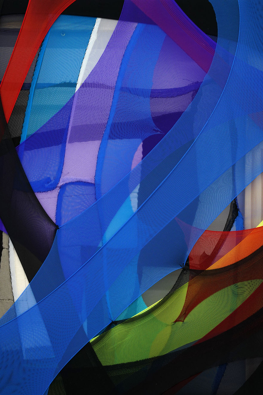 abstract fabric piece with blue, purple, green red and black