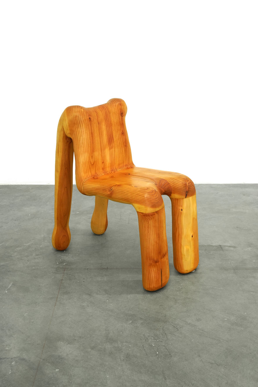 wooden chair shaped like a human