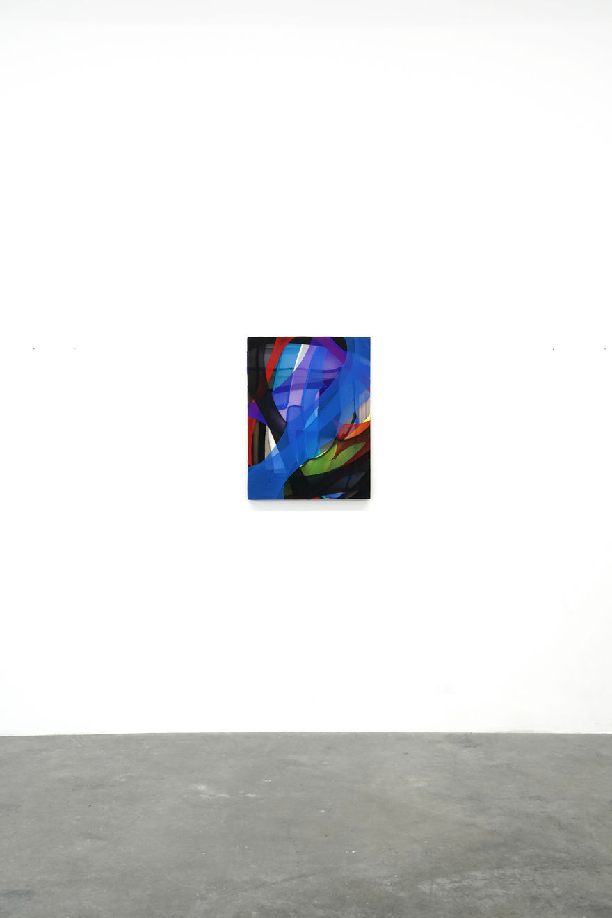 abstract fabric piece with blue, purple, green red and black