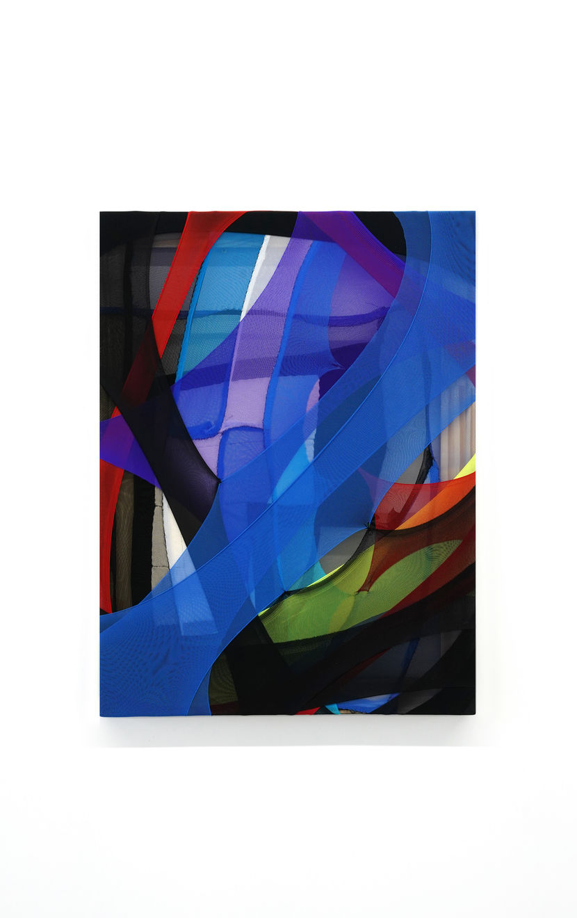 abstract fabric piece with blue, purple, green red and black