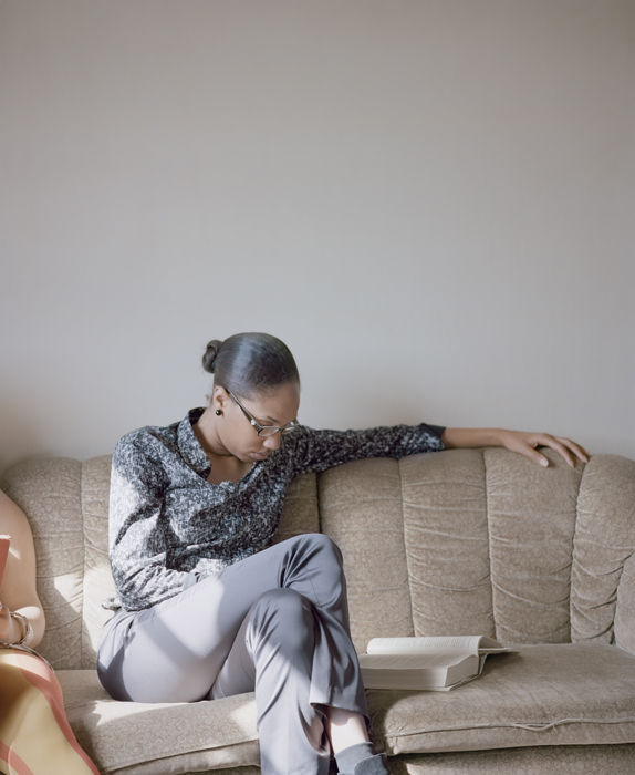 Carrie Schneider, LaToya reading Isabel Wilkerson (The Warmth of Other Suns: The Epic Story of America's Great Migration, 2010)from the series Reading Women (2012-2014), 2014