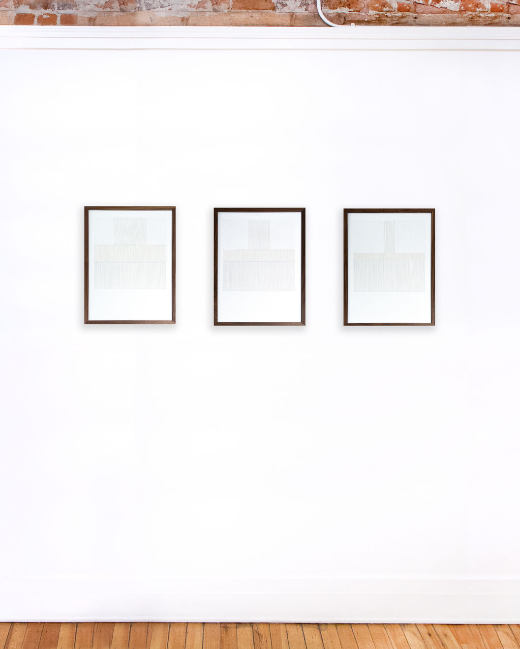 Triptych of framed white thread on paper works by Fringe Gallery artist Rebecca Messier