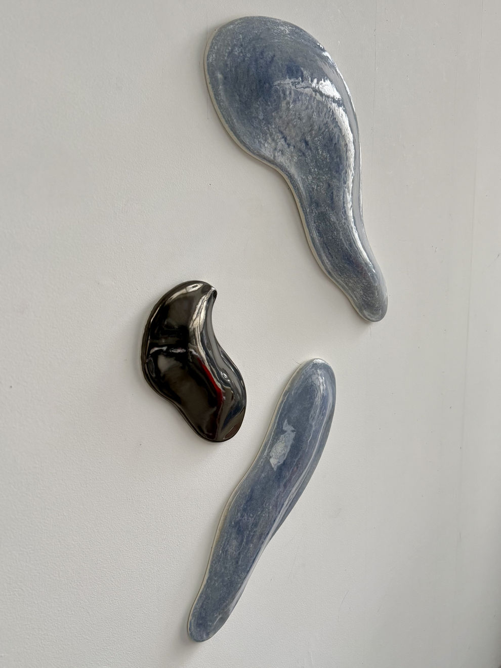 Glazed blue and black ceramic sculpture by Fringe Gallery artist Angela Okajima-Kempinas