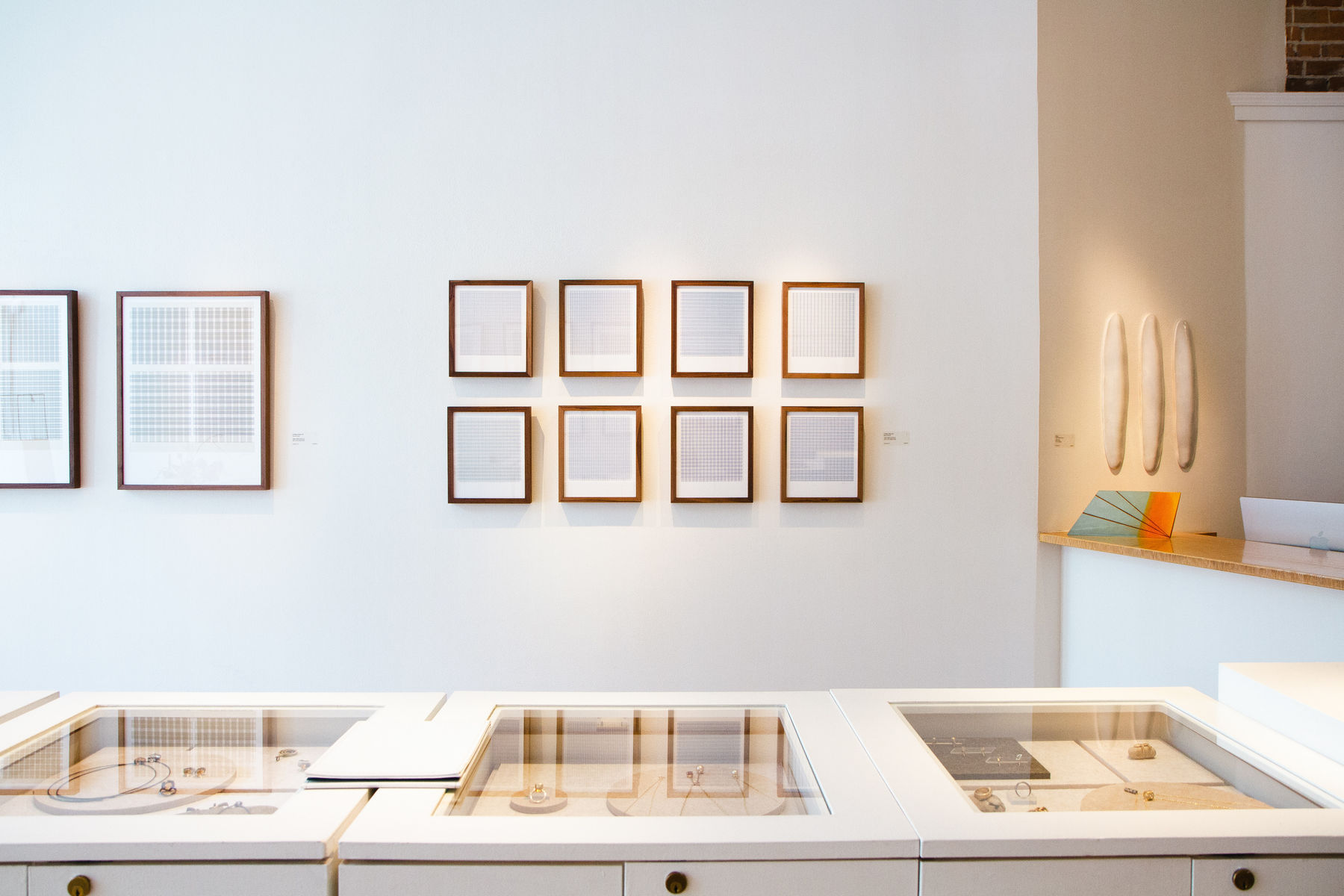 Series of framed blue thread on paper works by Fringe Gallery artist Rebecca Messier