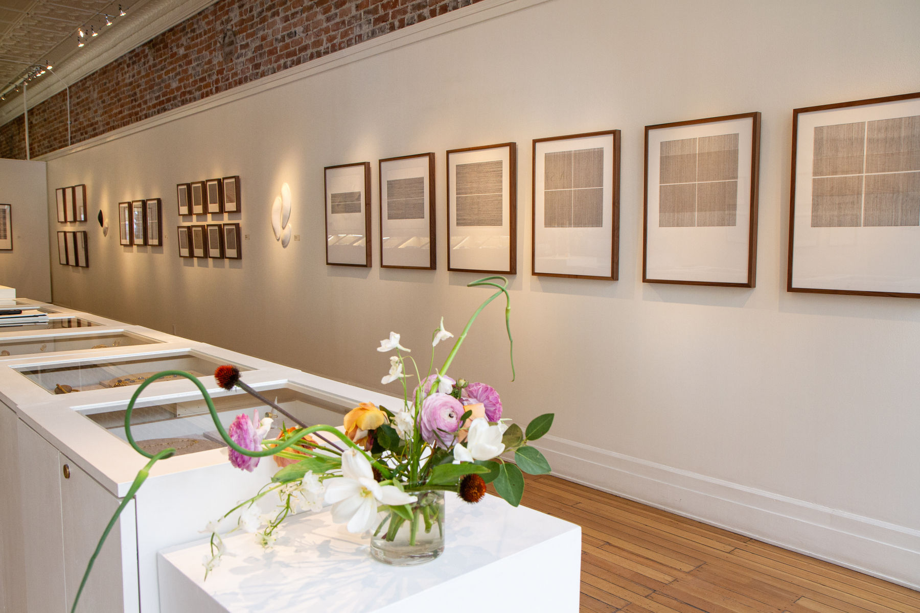 Series of framed black and white thread on paper works by Fringe Gallery artist Rebecca Messier