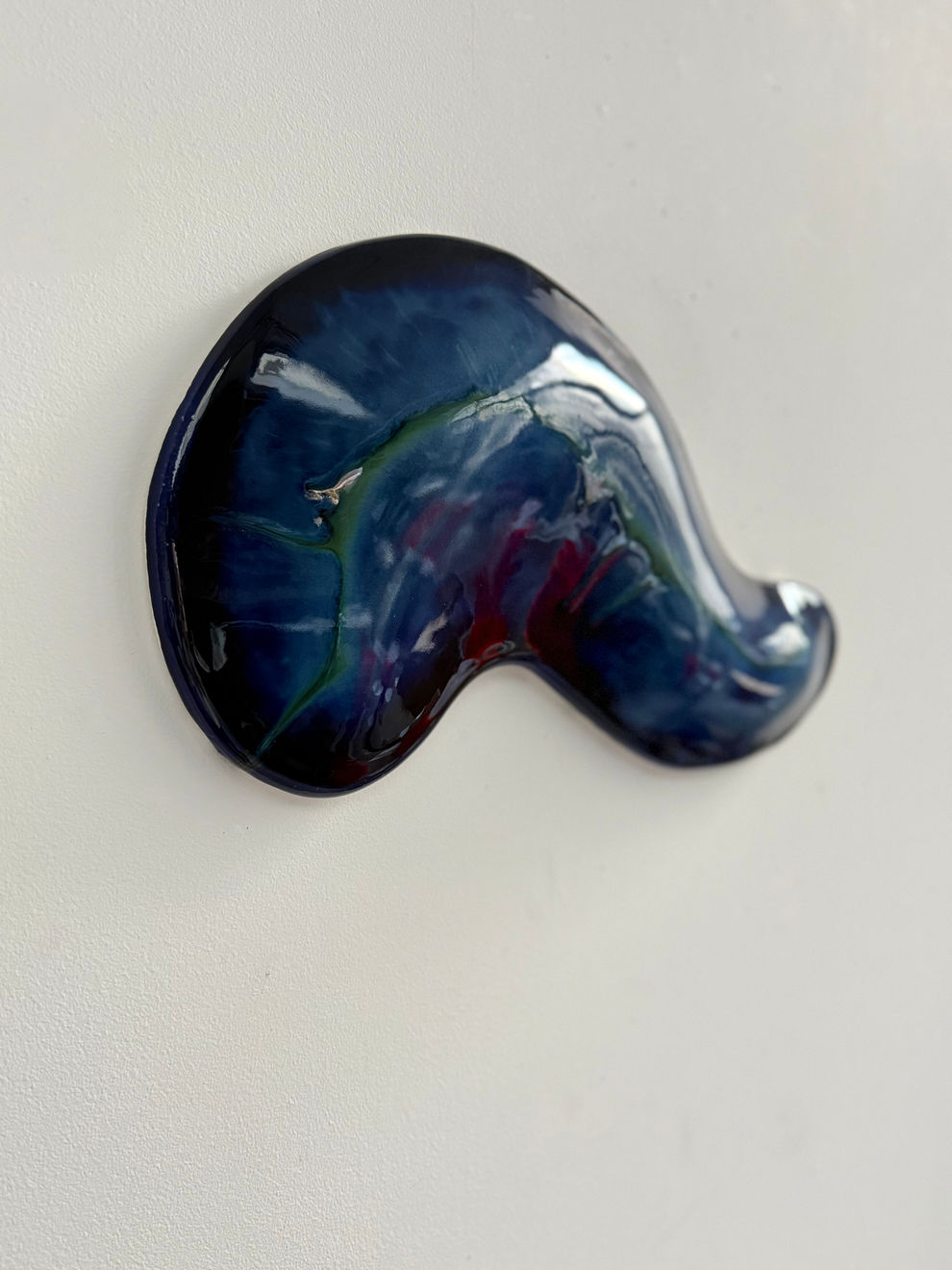 Glazed ceramic blue sculpture by Fringe Gallery artist Angela Okajima-Kempinas