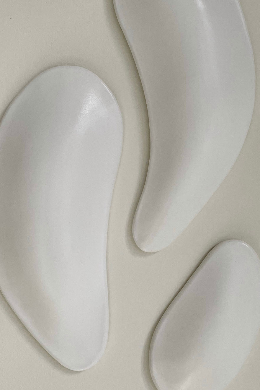 Ceramic petals that can be arranged in multiple ways by slate gray gallery artist Angela Okajima-Kempinas