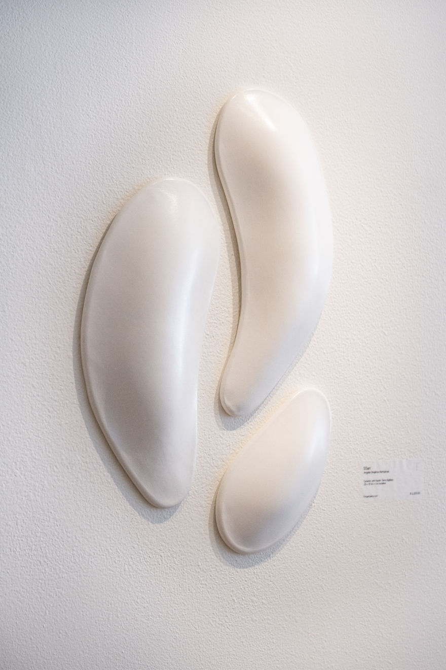 Ceramic petals that can be arranged in multiple ways by slate gray gallery artist Angela Okajima-Kempinas