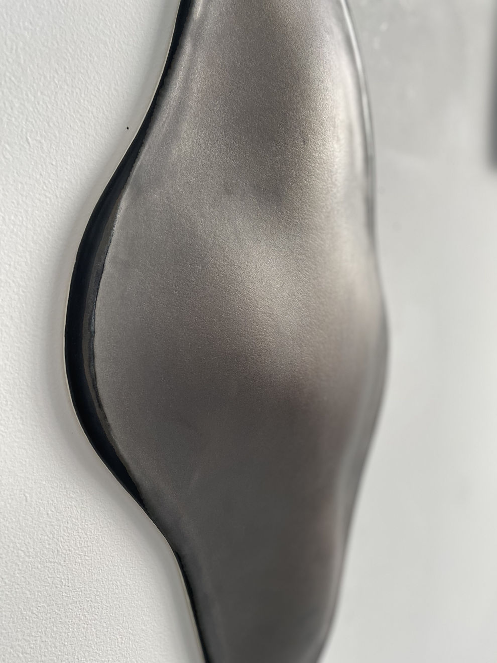 Glazed gray ceramic sculpture by Fringe Gallery artist Angela Okajima-Kempinas