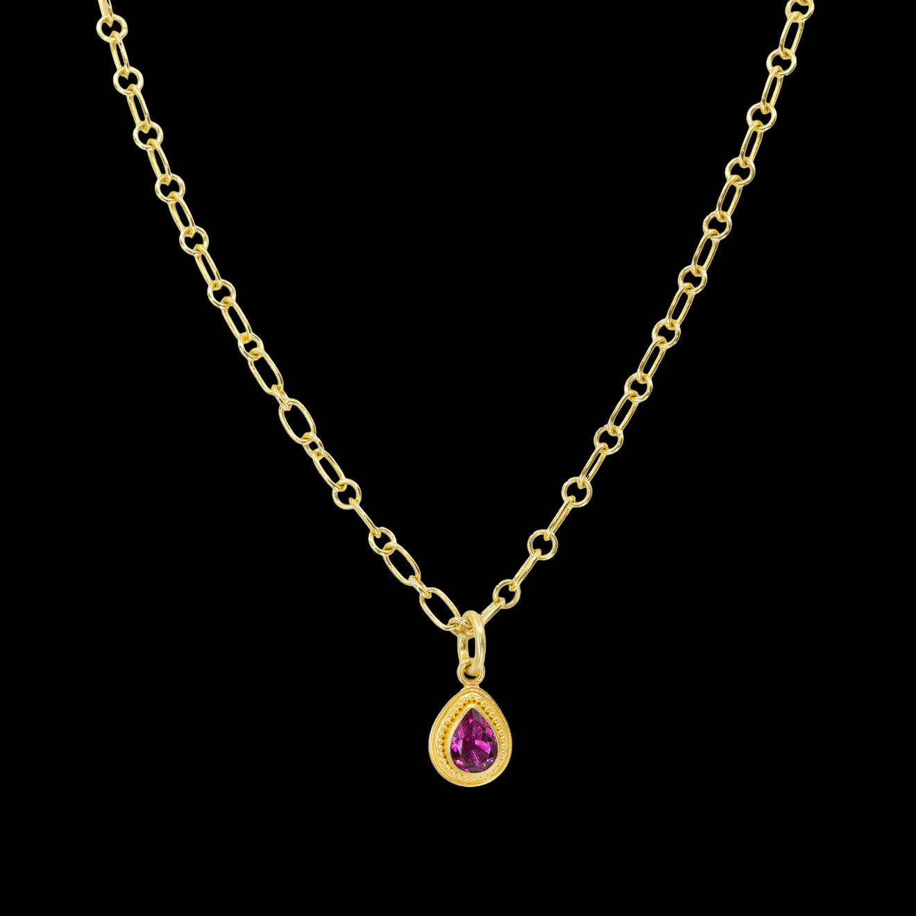 22k yellow gold necklace pendant with granulations with pink pear shaped tourmaline by Fringe Gallery studio jeweler Nanci Modica