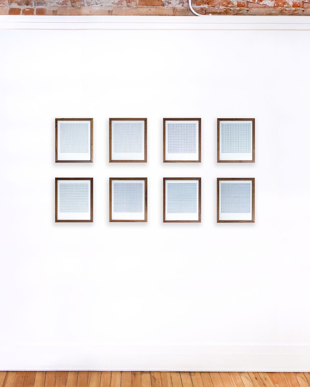 Series of framed blue thread on paper works by Fringe Gallery artist Rebecca Messier