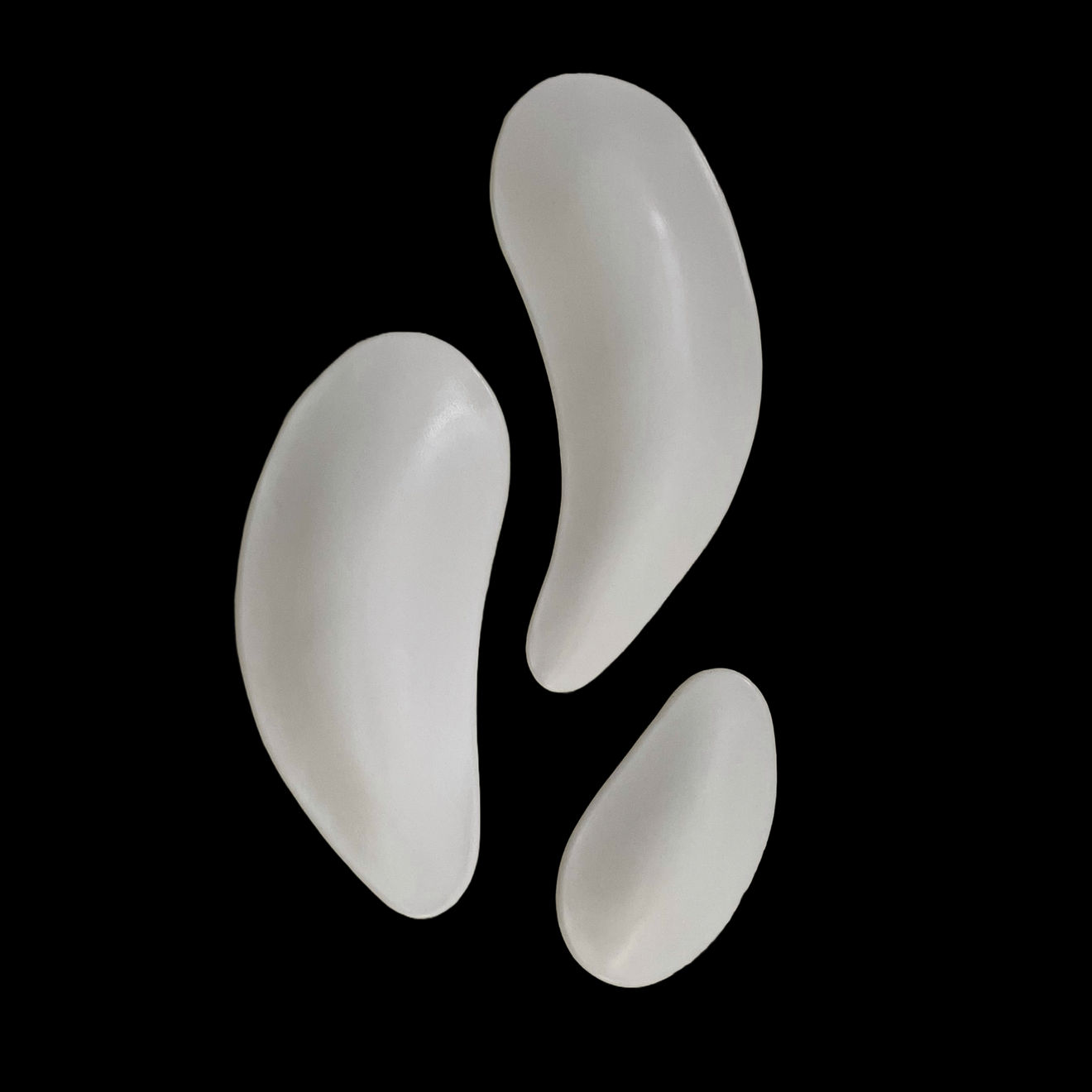 Ceramic petals that can be arranged in multiple ways by slate gray gallery artist Angela Okajima-Kempinas