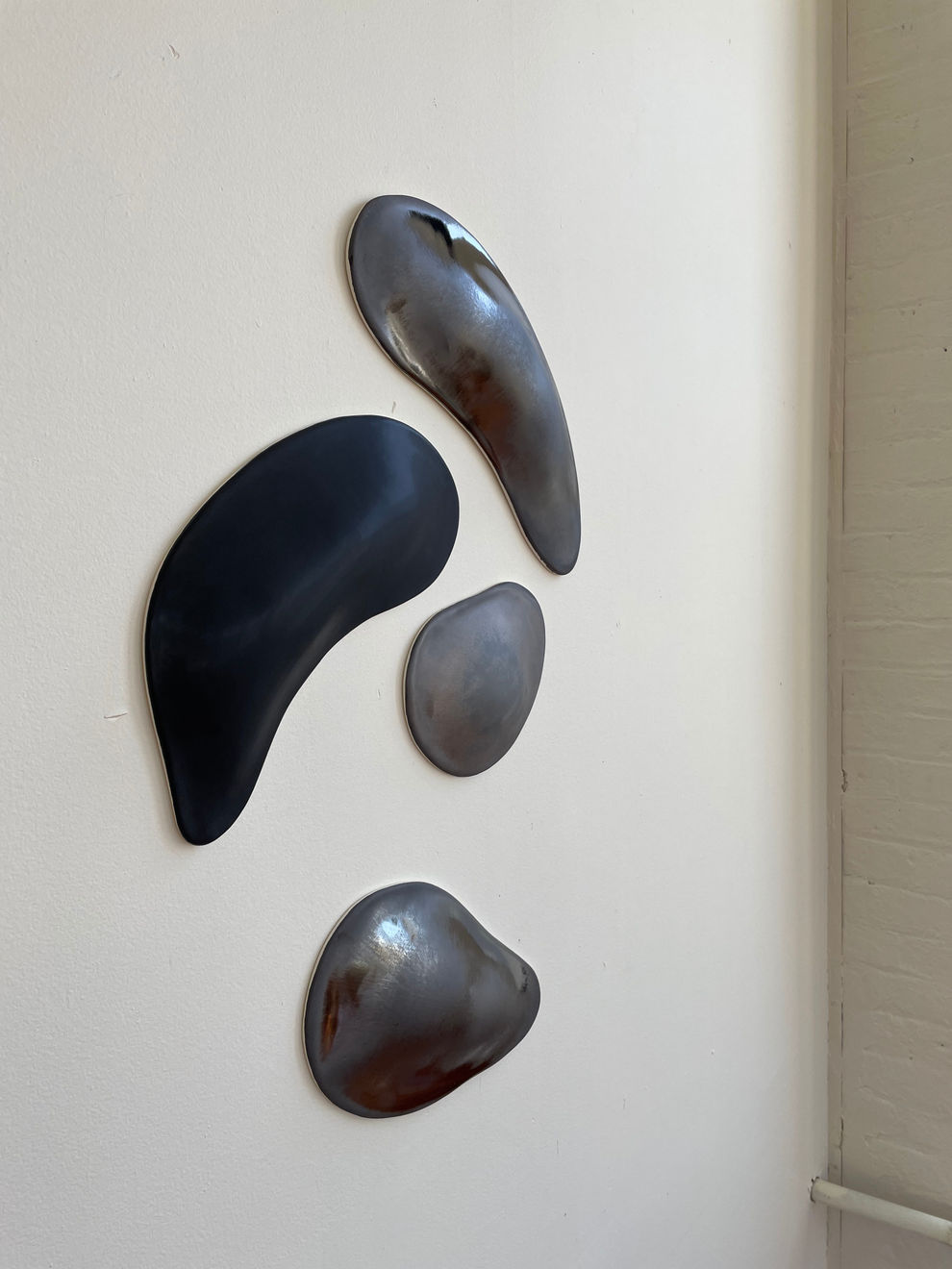 Glazed gray and black organic ceramic sculpture by Fringe Gallery artist Angela Okajima-Kempinas