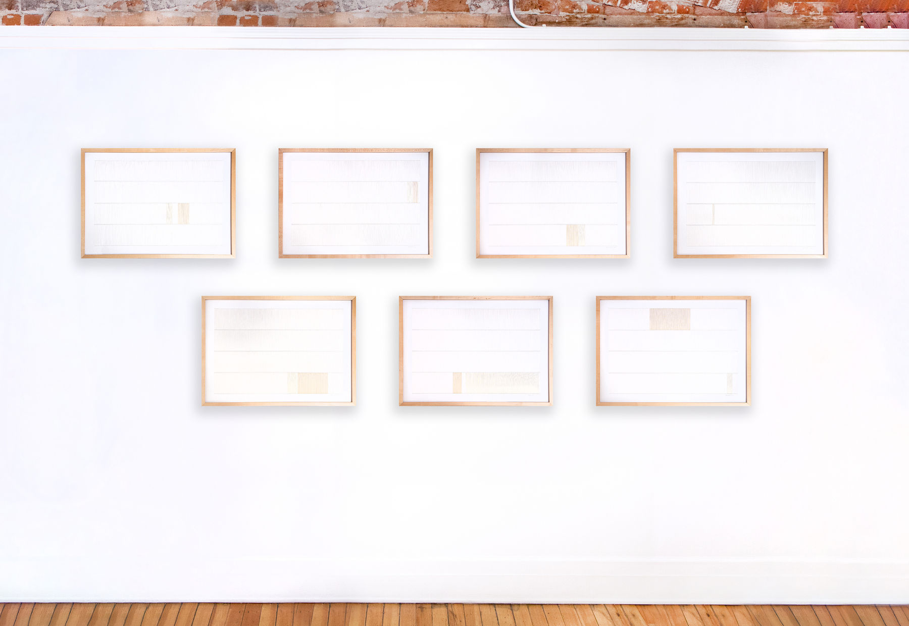 Framed white and tan thread on paper works by Fringe Gallery artist Rebecca Messier