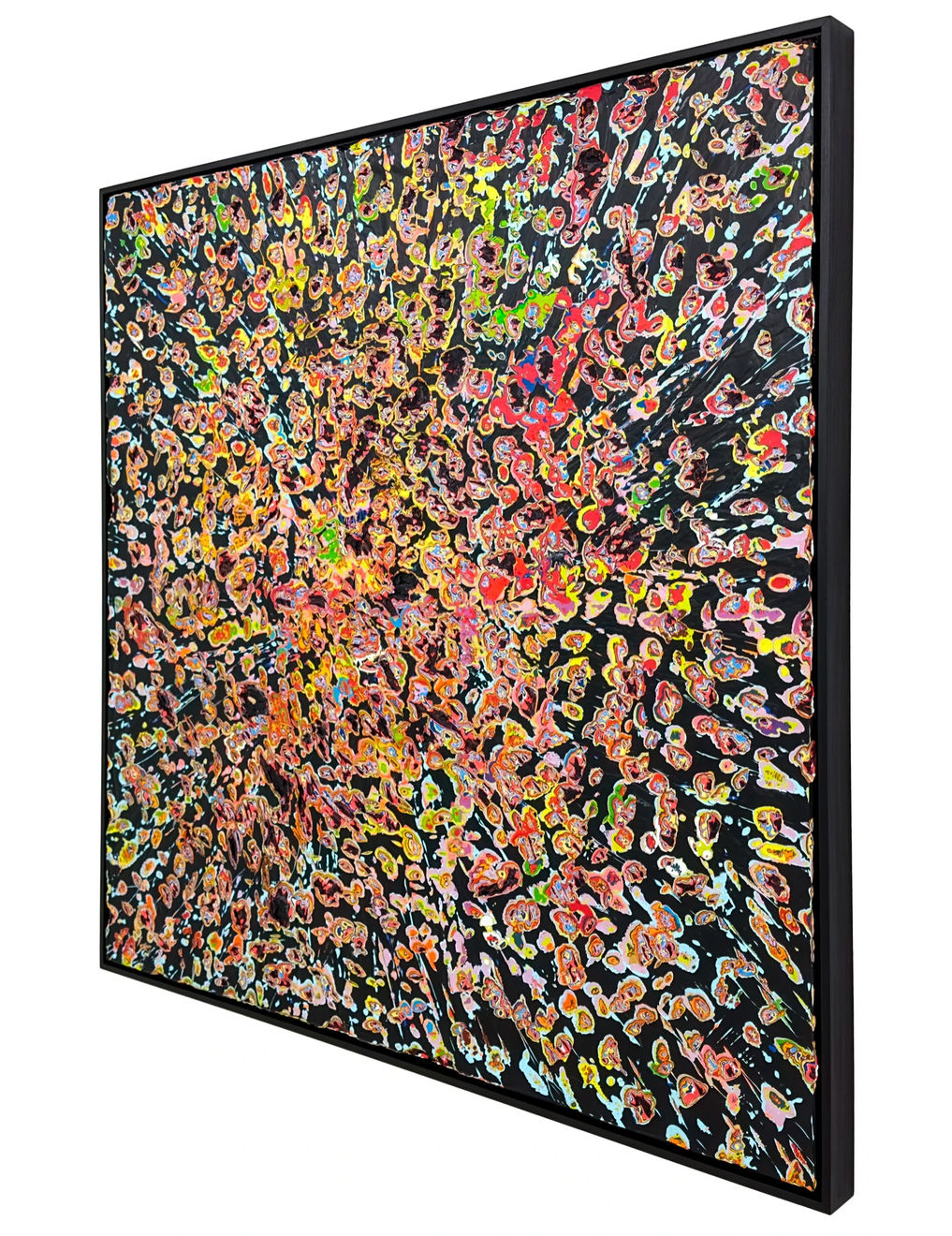 Side view of Jason Hallman excavated painting with black background and multi colored excavation spots with red blue green and yellow