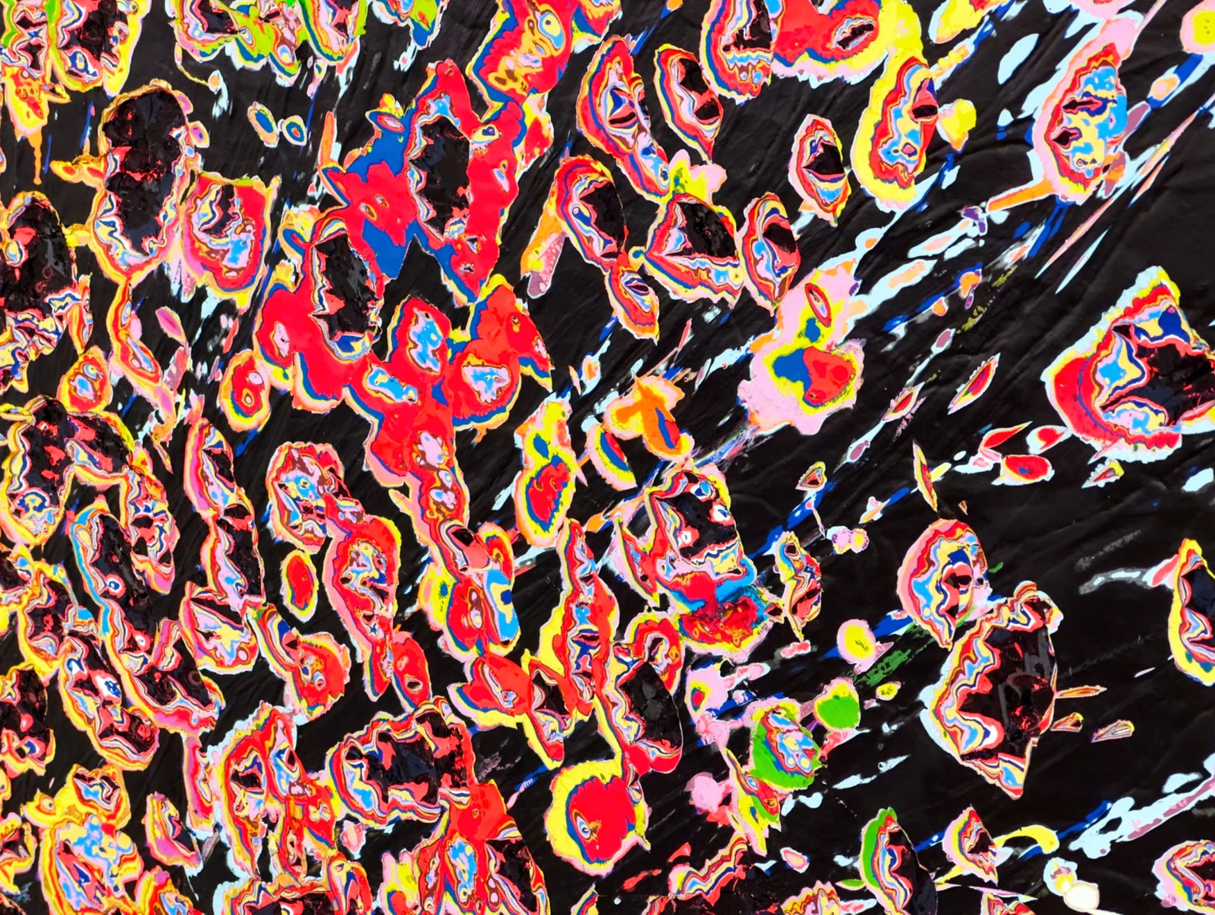 detail view of Jason Hallman excavated painting with black background and multi colored excavation spots with red blue green and yellow