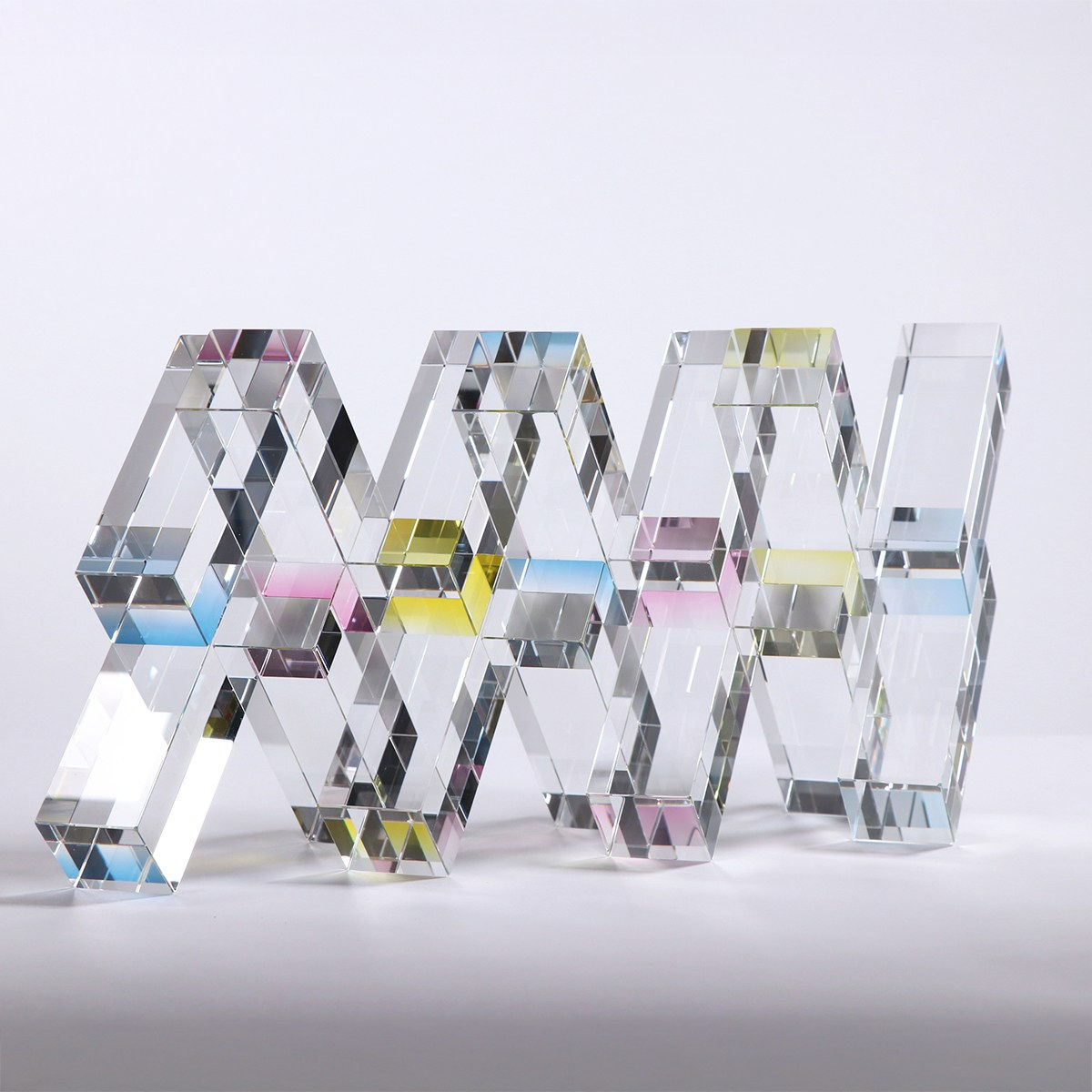 Cubic Dylan Martinez glass sculpture refracting visible light frequencies