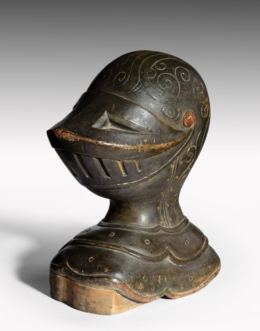 Coulborn antique patinated carved wood armet