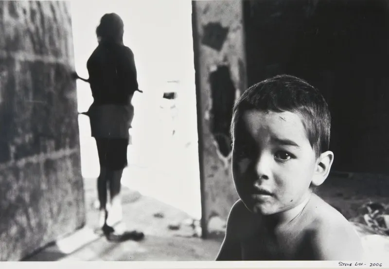 Steve Liss, Untitled (A Child and a Doorway), 2006
