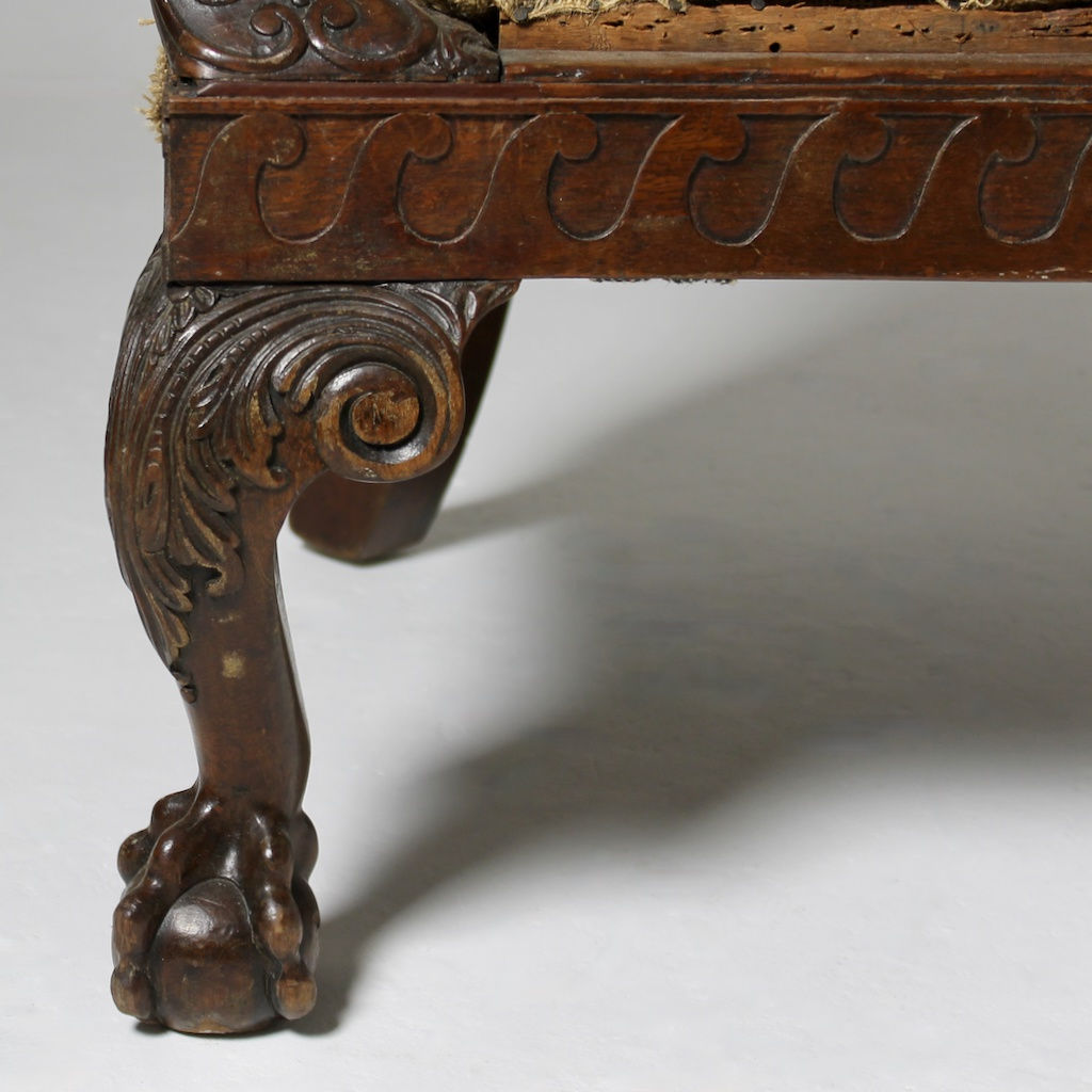 A LARGE 19th CENTURY CARVED MAHOGANY LIBRARY ARMCHAIR ( sold )
