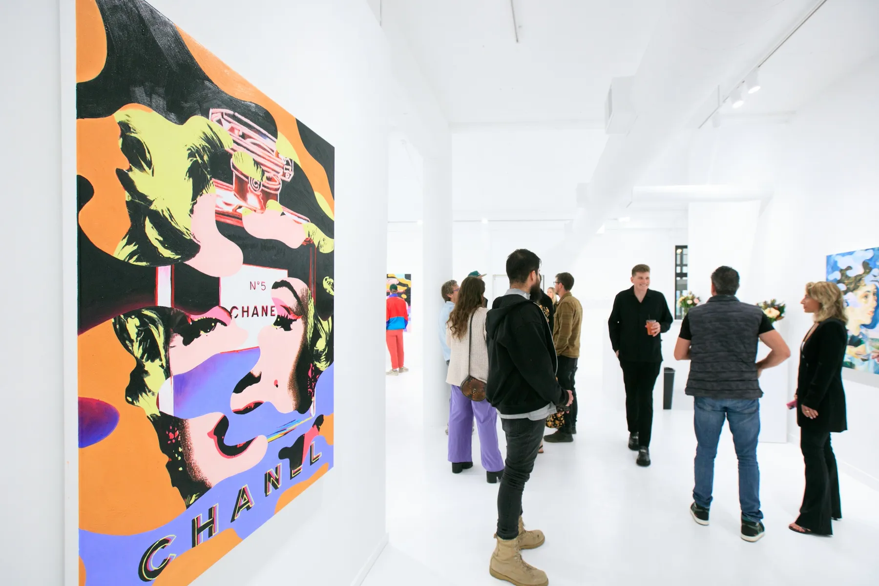 Guests at the opening reception for Dan Alva's "Something Out of Nothing" & Kenny Scharf's "Woodz 'N Thingz" presentation