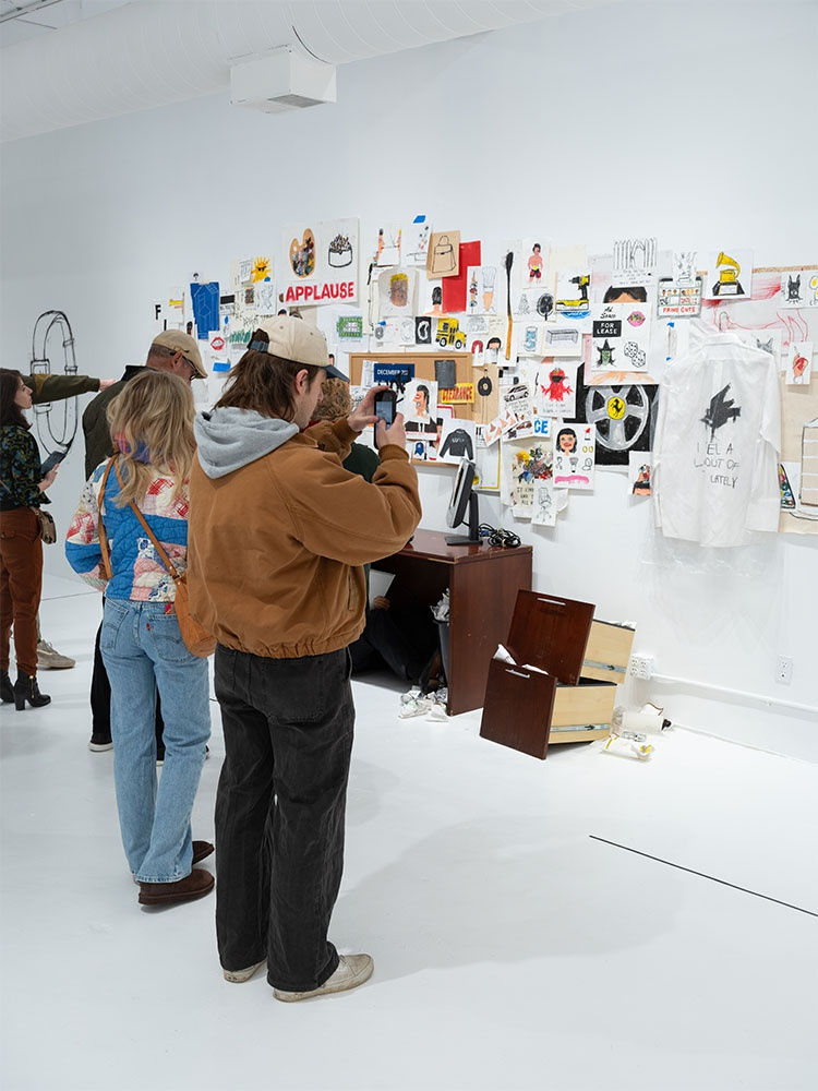 Guests at Sage Barnes's "Employee Of The Month" opening reception