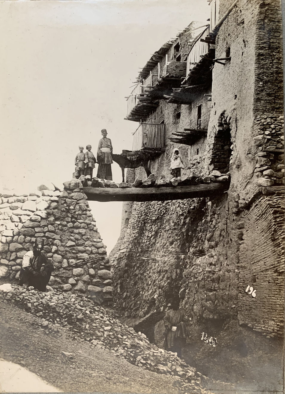 Antoin Sevruguin, A group standing by the Izad Khast drawbridge , Late 19th Century or early 20th Century