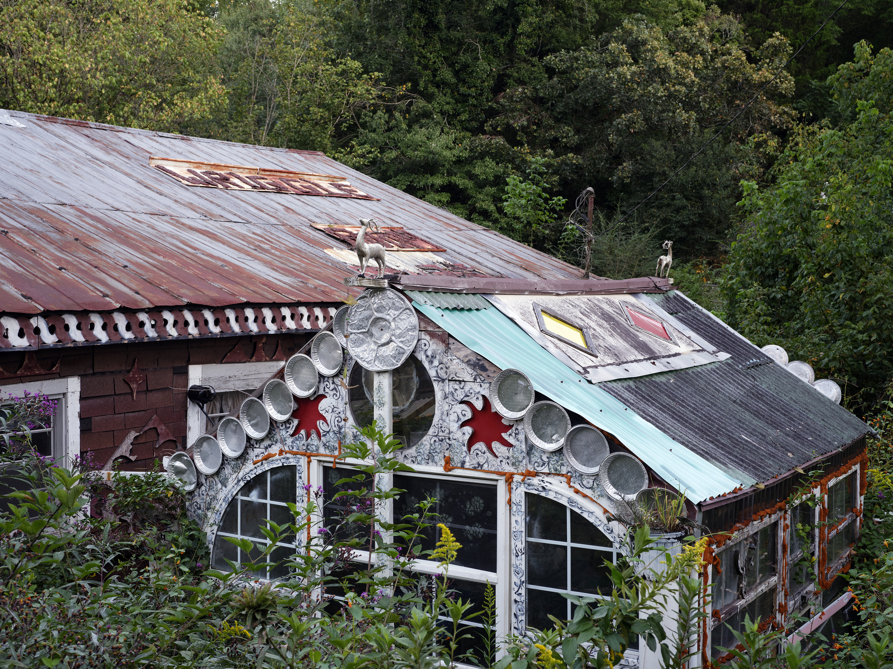 Two house like structures that are forgotten