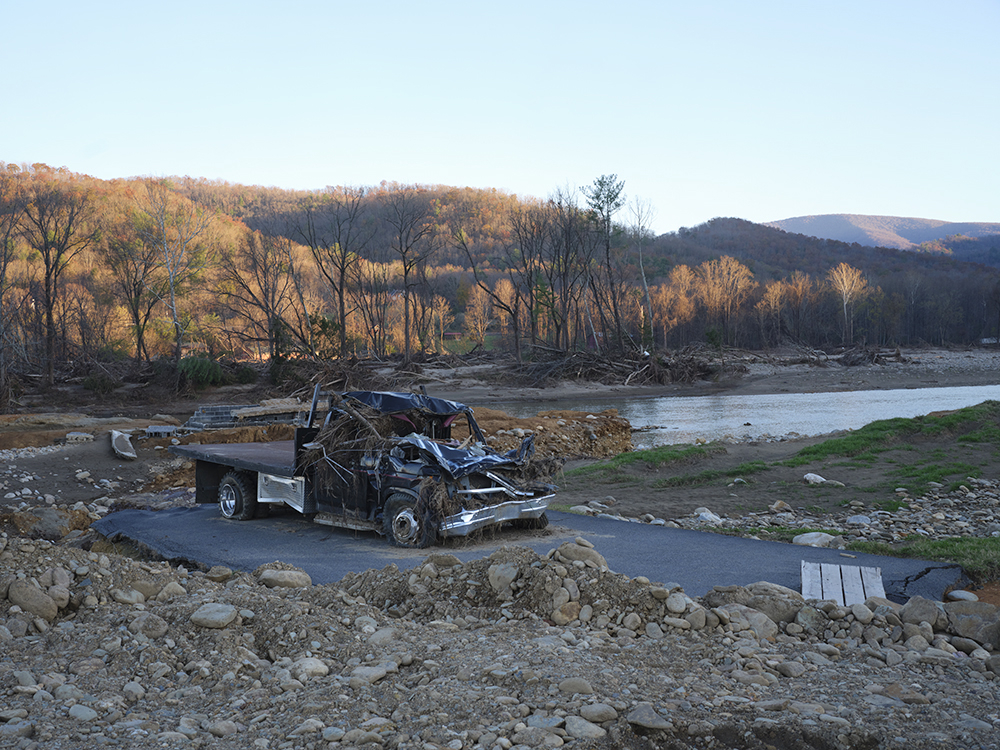 Black truck in a dried up river bed
