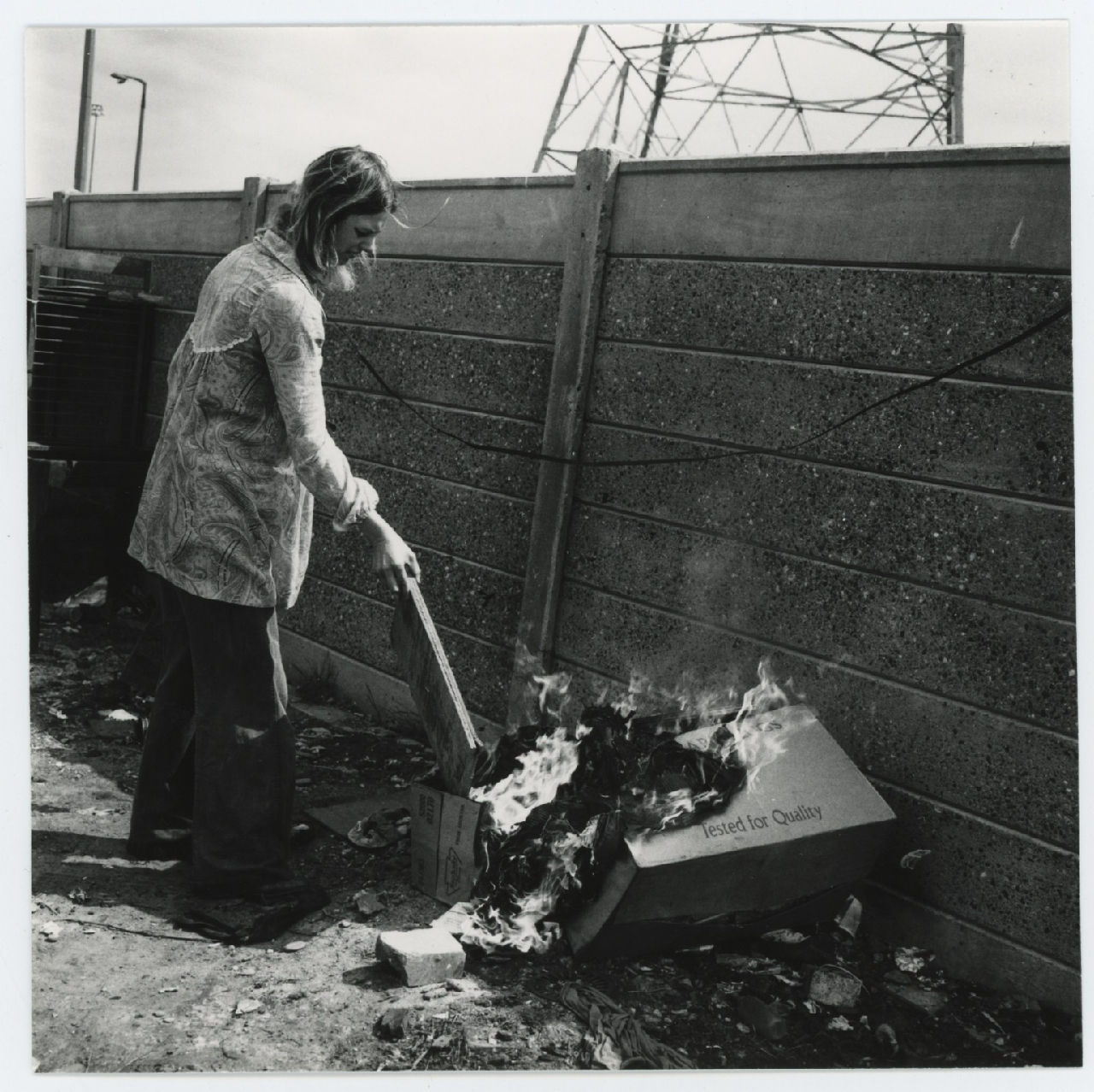 Jo Spence, Gypsies (woman burning rubbish), 1974