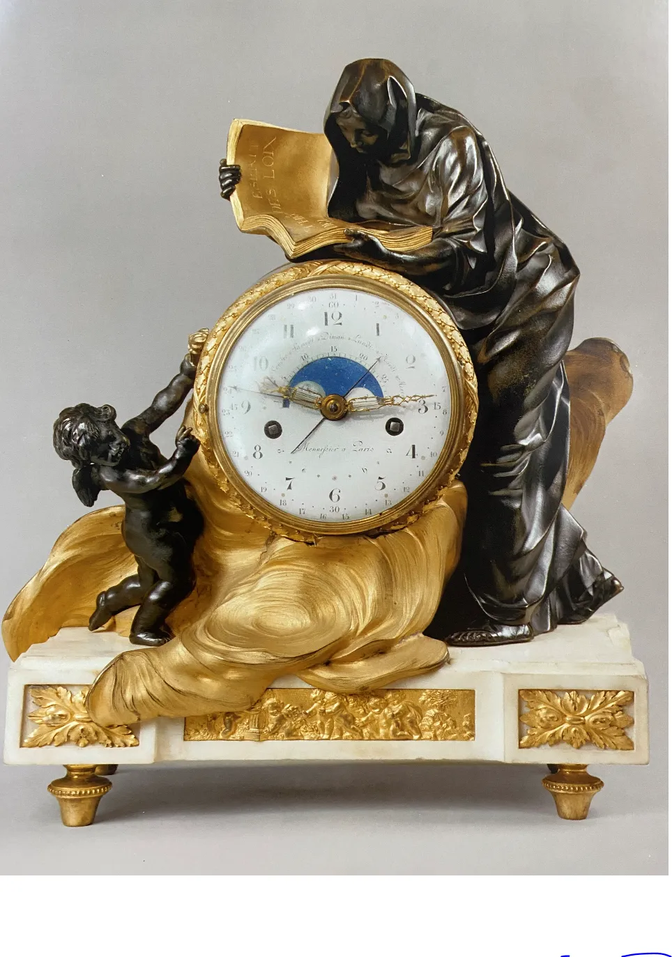 A Louis XVI chased and gilt bronze clock with patinated bronze characters, 18th century