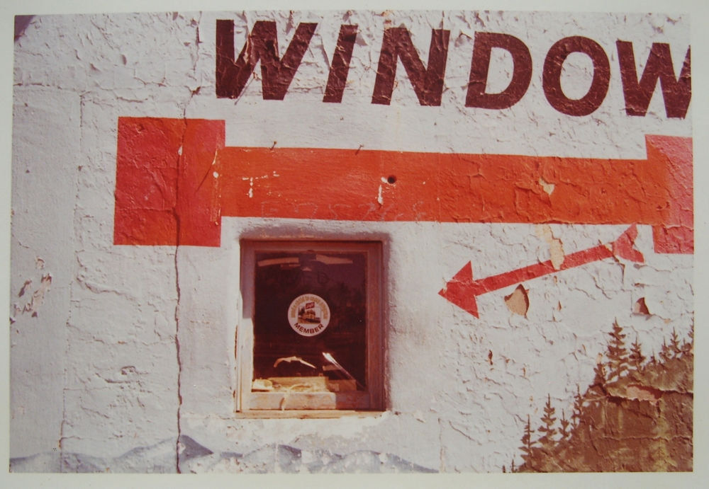 William Eggleston, Untitled (Window with Red Arrow and Partial Painted Landscape), 1972