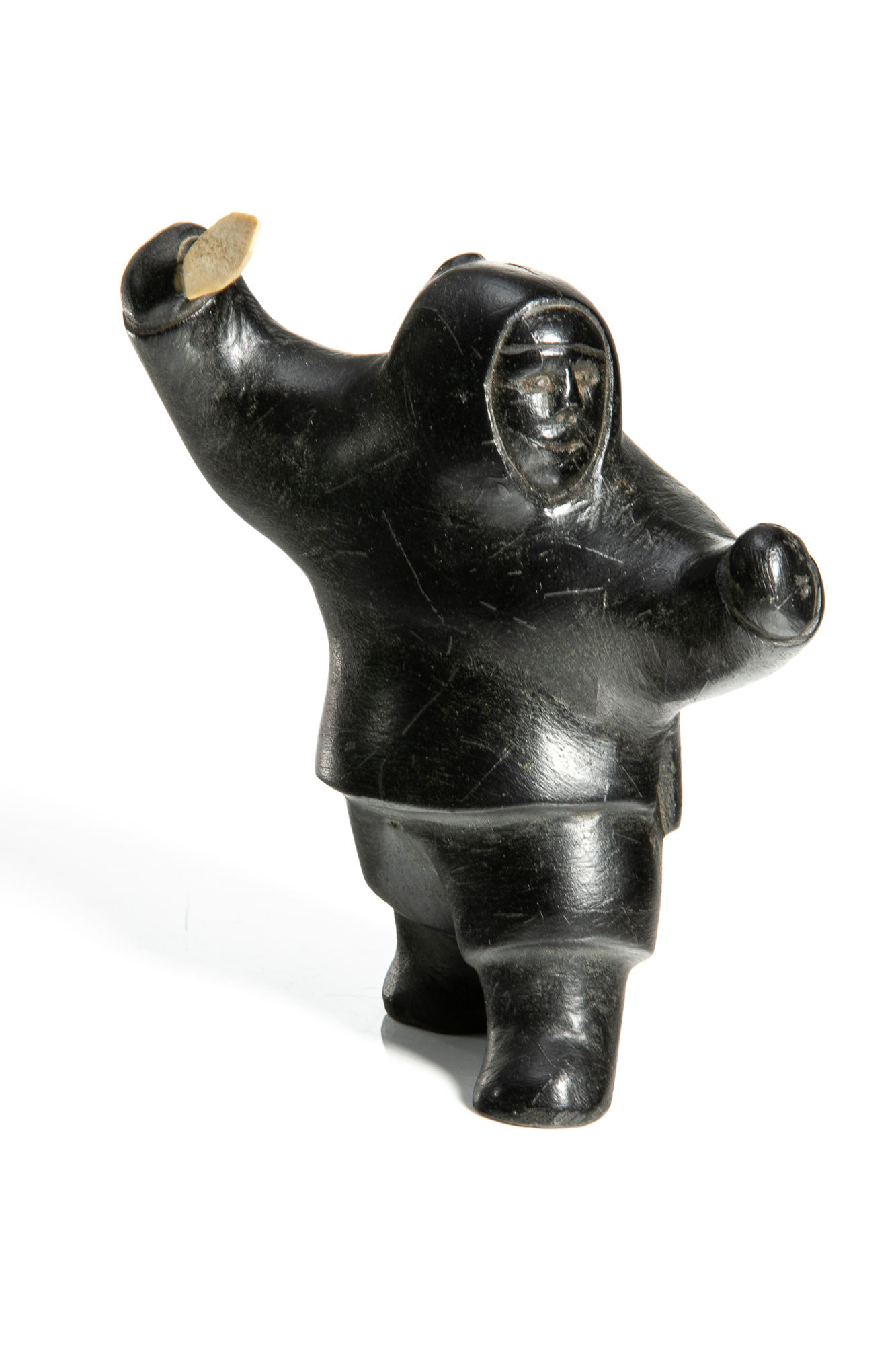 DAVID IKUTAAQ (1929-1984) QAMANI'TUAQ (BAKER LAKE) Hunter with Knife, late 1970s stone and antler, 5.25 x 5 x 2.75 in (13.3 x 12.7 x 7 cm) $800