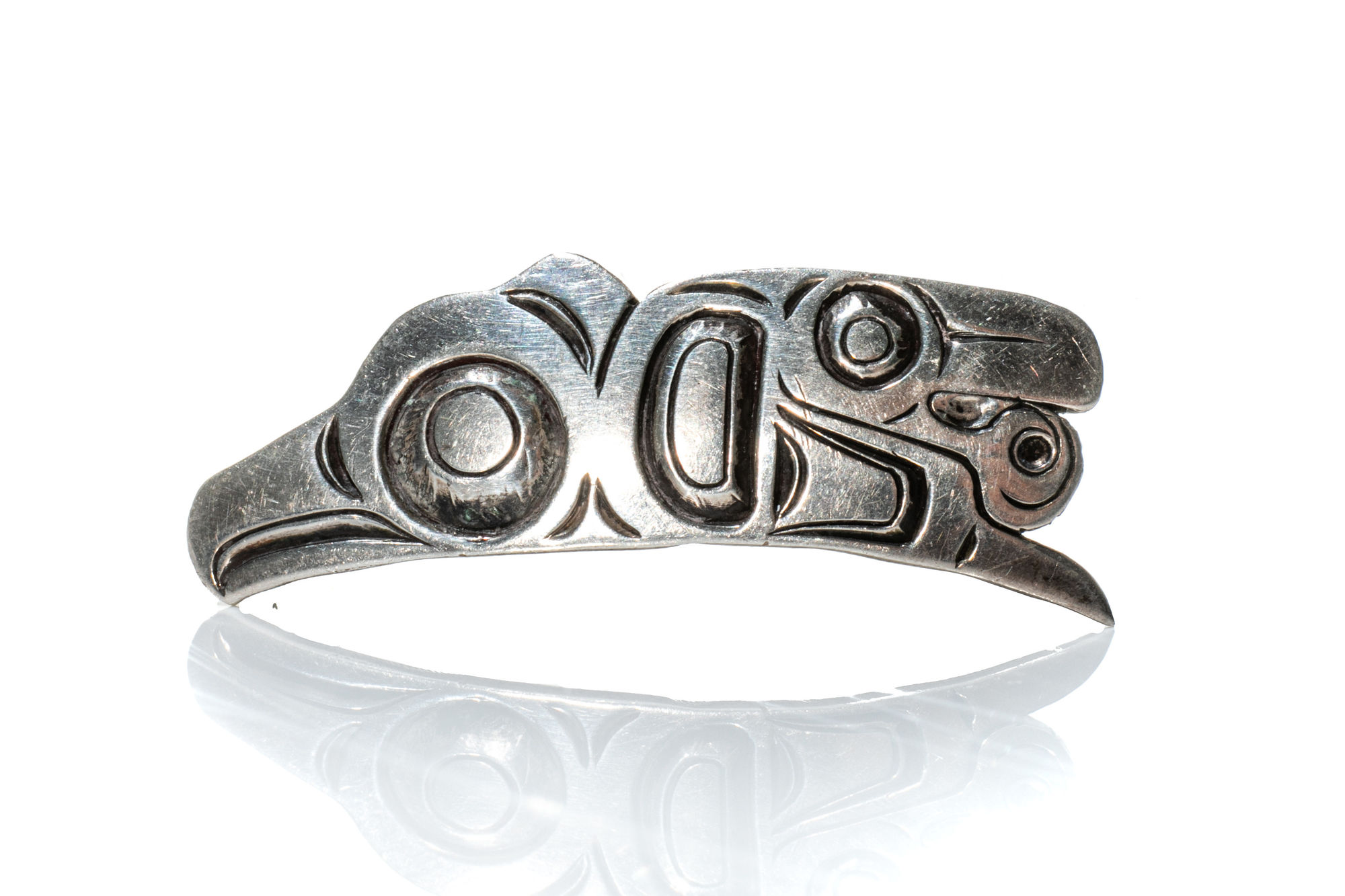 PHIL JANZE (1950-2016) GITSKAN Pendant cast sterling, 0.5 x 1.5 x 0.25 in (1.3 x 3.8 x 0.6 cm) $150