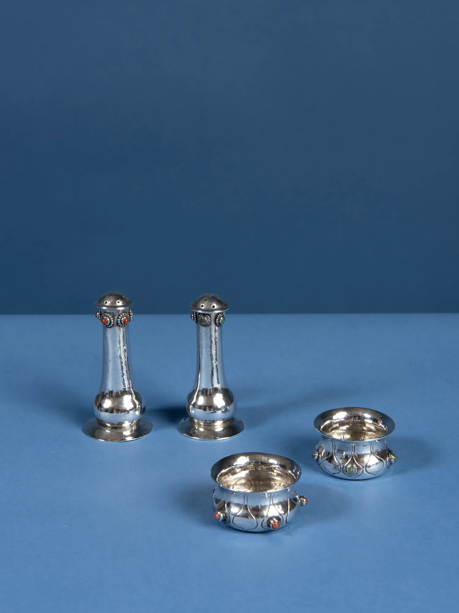 Charles Ashbee, A set of four salt and peppers, c.1900