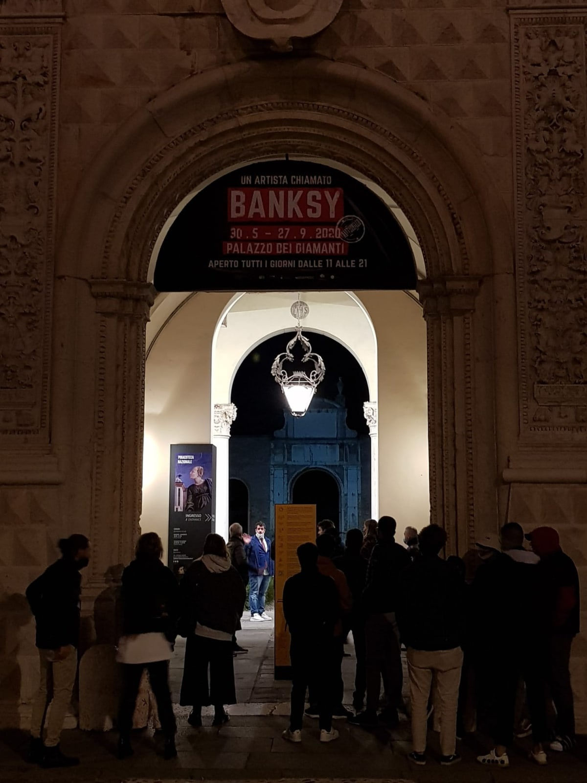 Banksy artwork hanging on wall