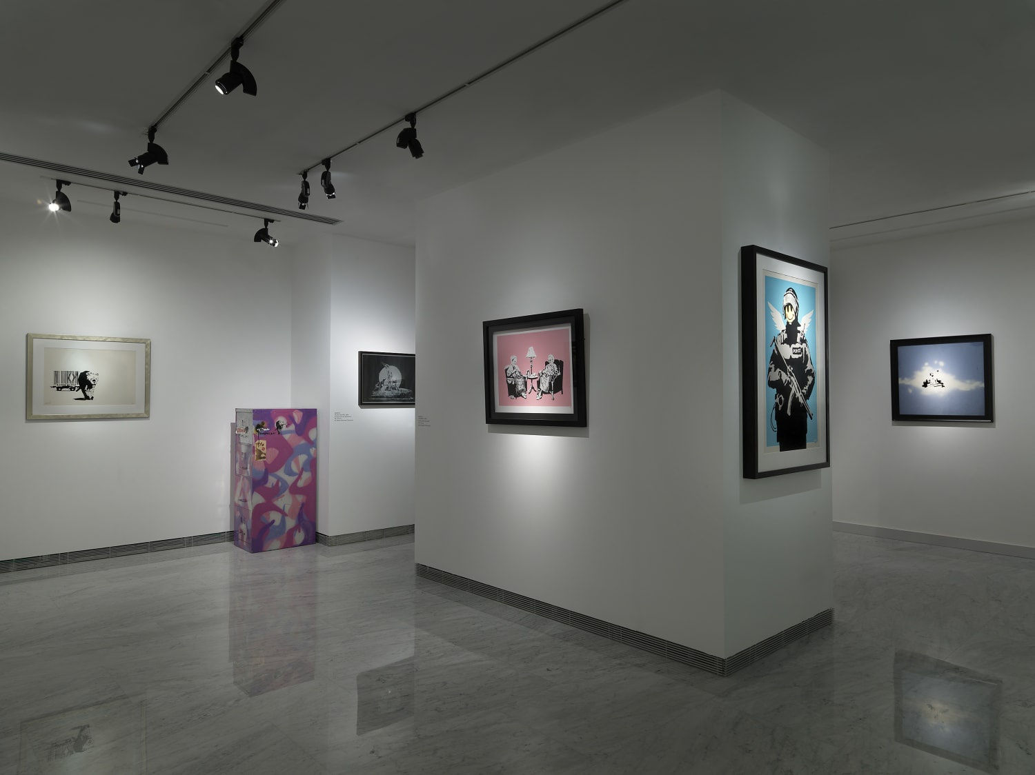 Banksy Exhibition installation, Prints hanging on the walls.