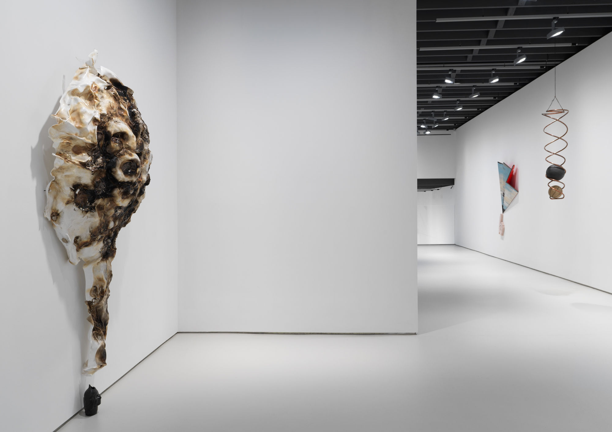 Installation views of the many sculptural works in Richard Hughes' solo exhibition at the gallery. Side angle of Hughes' "Woosah."